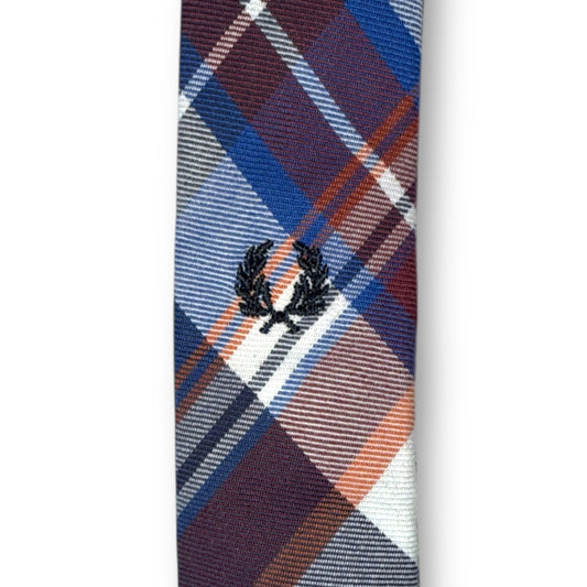 A navy and white gingham check tie with a distinctive pattern.