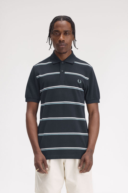 A person wearing a black and blue striped polo shirt with a collar.
