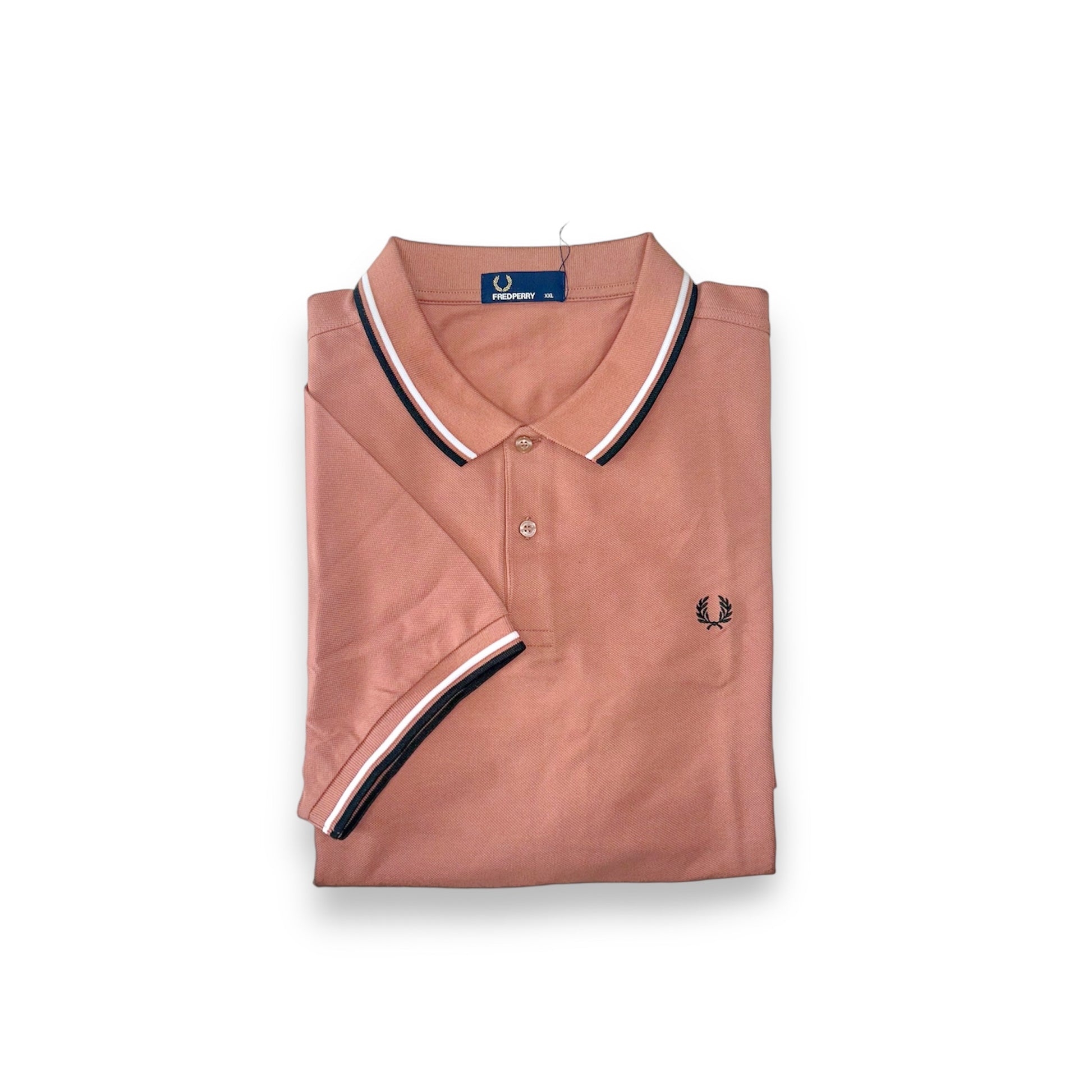 A pink Fred Perry polo shirt with a collar, featuring black stripes on the sleeves and the brand's logo on the chest.
