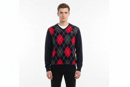 Man wearing a black and red argyle sweater on a white background