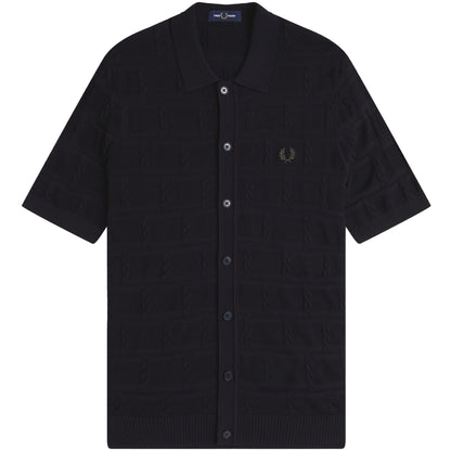 A black Fred Perry cable knitted short sleeve shirt with a crew neckline and a visible brand logo on the left chest.