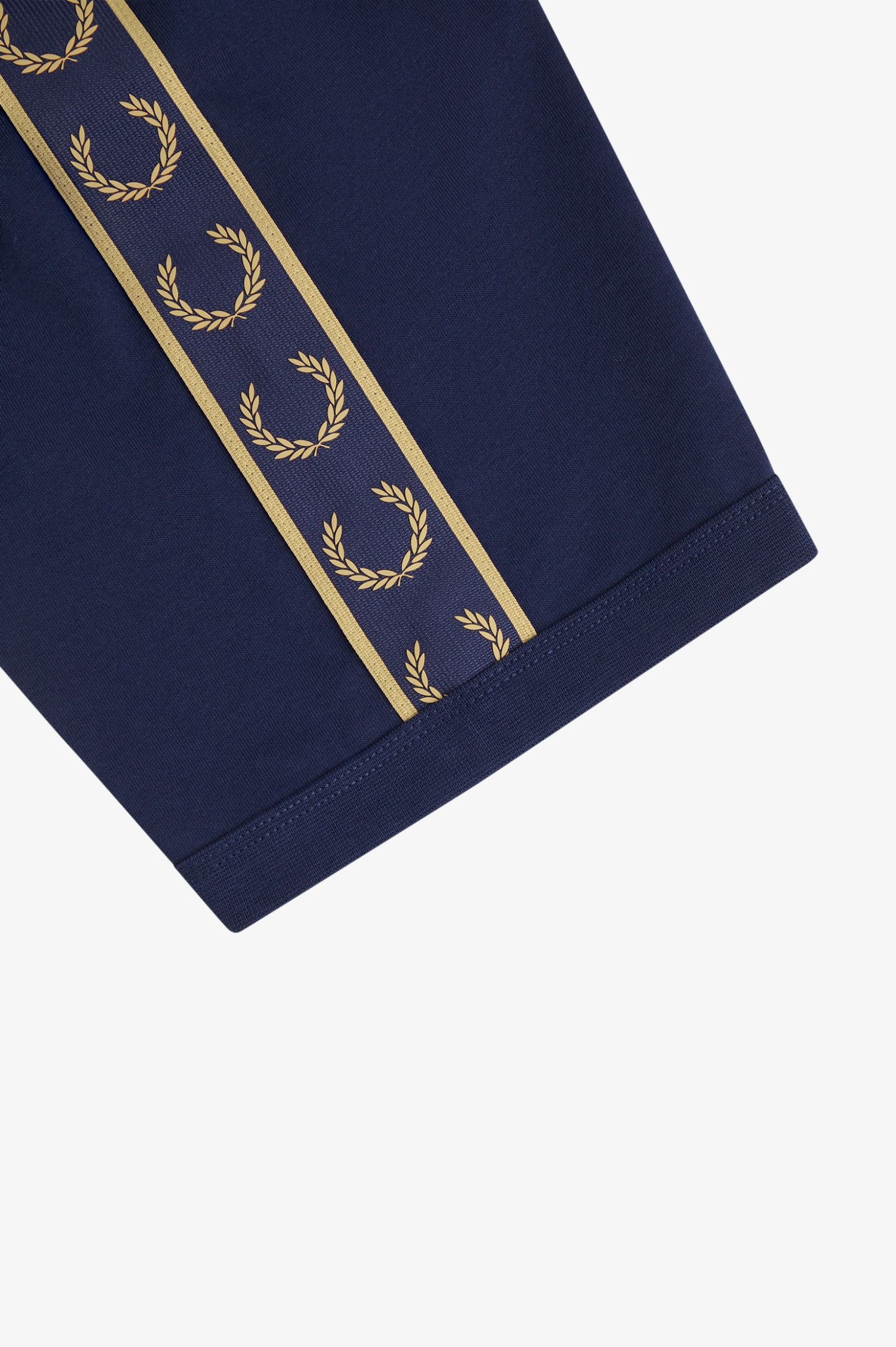 Navy blue fabric with gold laurel wreath pattern on a white background