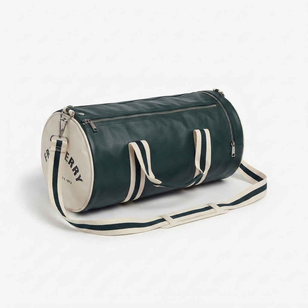A dark green leather duffel bag with cream-colored trim, handles, and a matching shoulder strap, featuring a cream circular end cap with the Burberry logo.