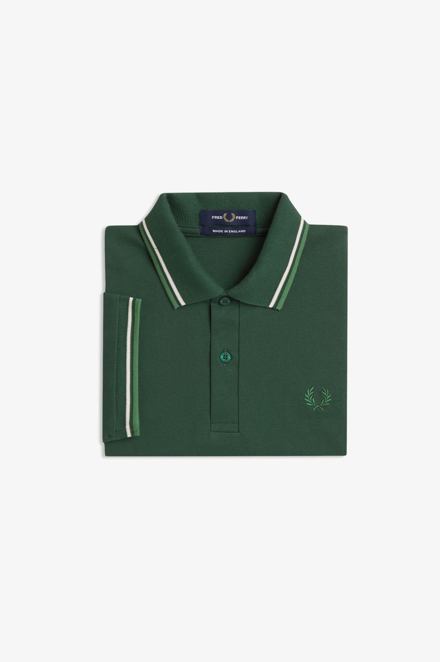 A folded dark green polo shirt with white and light green striped trim on the collar and sleeve cuff, featuring a small embroidered logo on the chest, set against a plain white background.