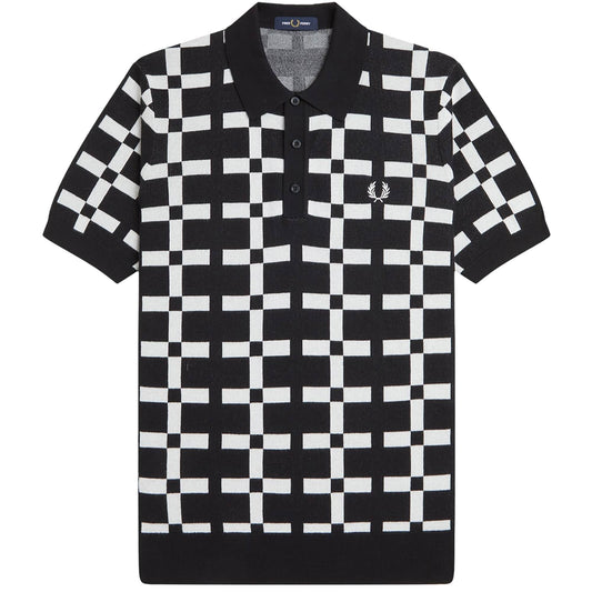 A black and white geometric jacquard knit polo shirt by Fred Perry.