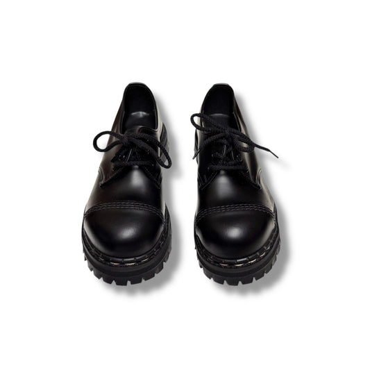 Pair of black leather shoes on a white background