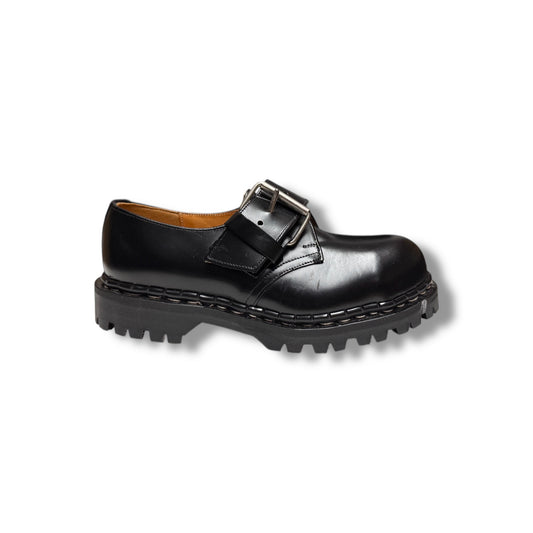 A black leather monk shoe with a unique grip sole.