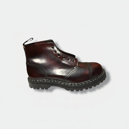 A burgundy leather boot with a steel cap and six eyelets for lacing, set against a white background.