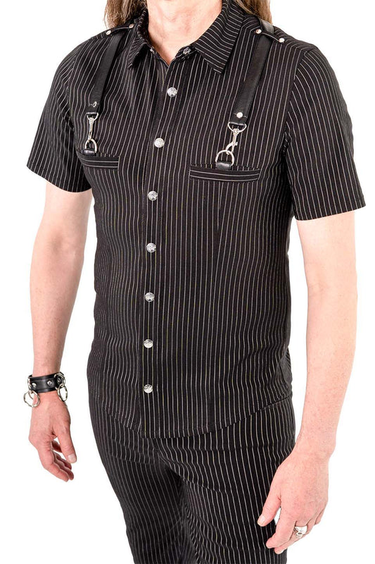 Person wearing a black pinstripe shirt with suspenders on a white background