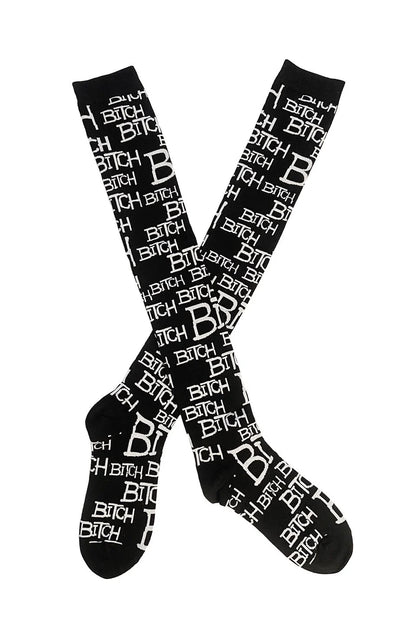 Lip service black socks with white text pattern on a white background