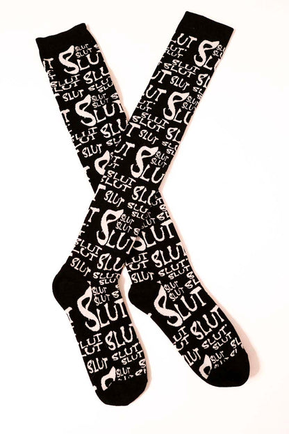 Black lip service  socks with white text pattern on a white background