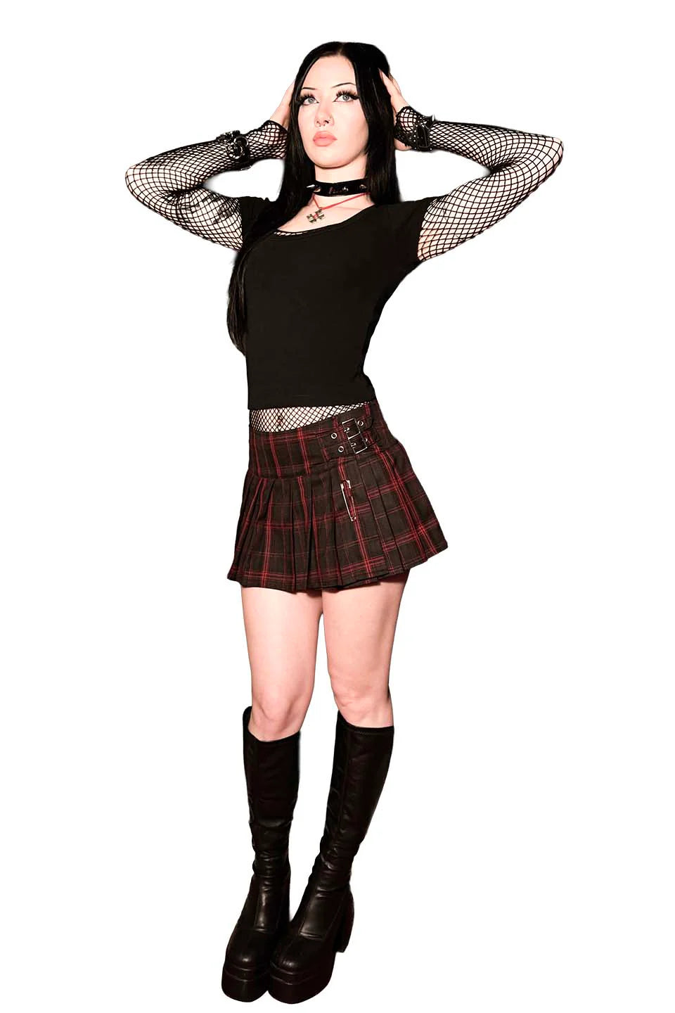 Person wearing a lip service world end pleated mini skirt black top, plaid skirt, and black boots on a white background