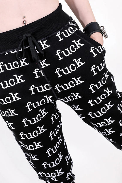 Black pants with 'fuck' printed repeatedly on a white background
