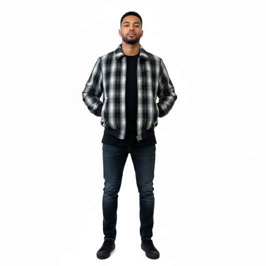 Man wearing a black and white checkered shirt over a black t-shirt on a white background