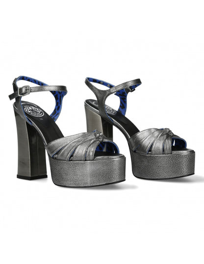 Pair of high-heeled platform shoes with black and blue design on a white background