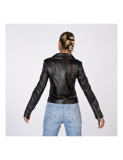 Person wearing a black leather jacket and blue jeans on a white background