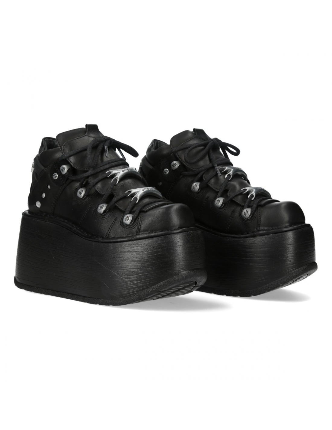 Black platform sneakers on a white background