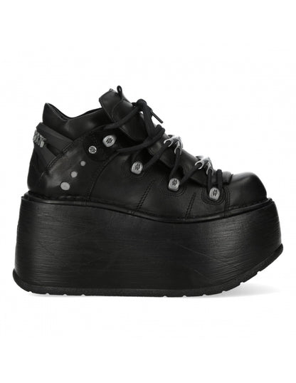Black platform sneaker on a white background