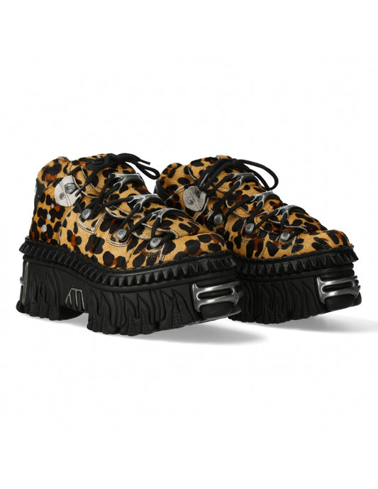 Leopard print shoes with black platform sole on a white background