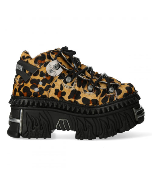 Leopard print sneaker with black sole on a white background