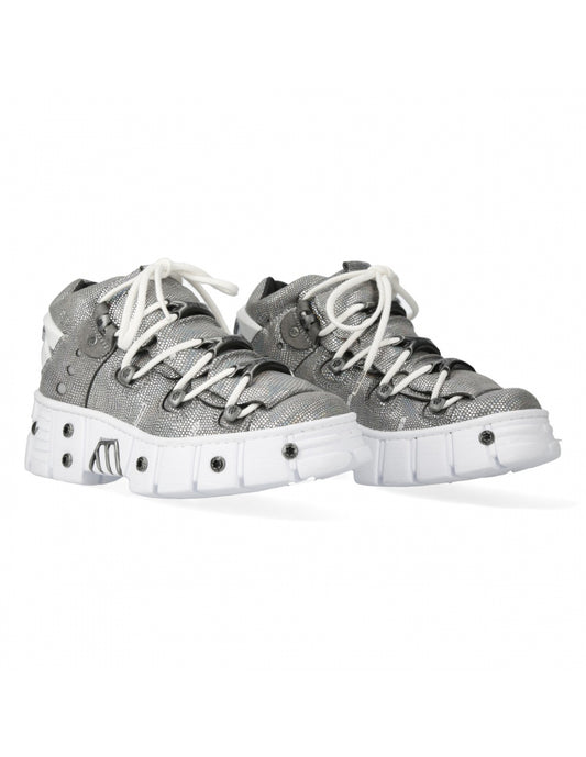 Gray sneakers with white laces on a white background