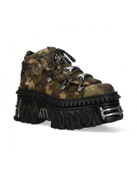 Camouflage boot with chunky black sole on a white background