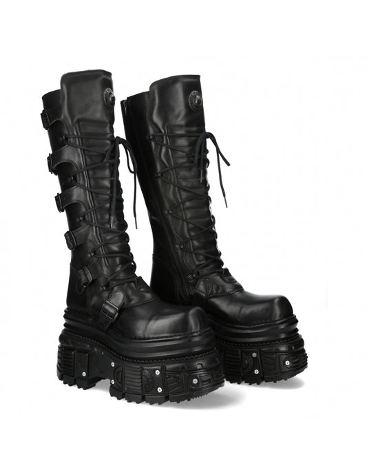 Black leather boots with multiple buckles on a white background
