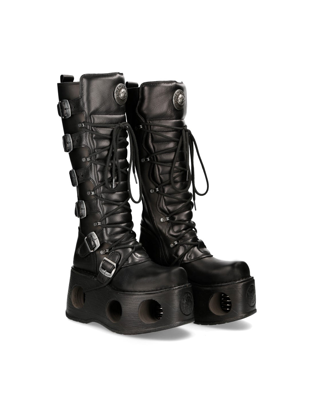 Black platform boots with buckles and eyelets on a white background