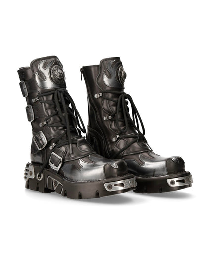 Pair of black and silver high-top boots on a white background