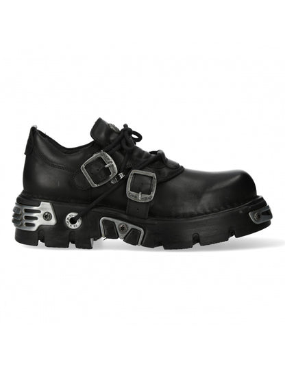 Black leather shoes with metal buckles and sole designs on a white background