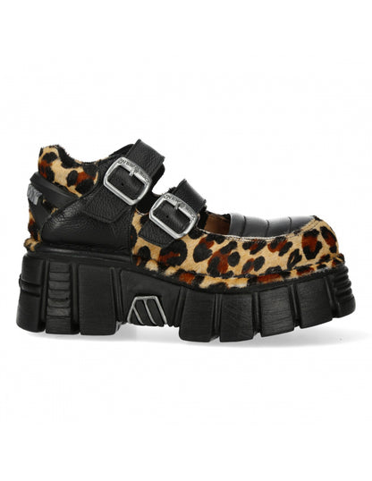Black platform shoes with leopard print fur and silver buckles on a white background