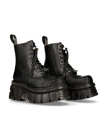 Pair of black leather boots on a white background