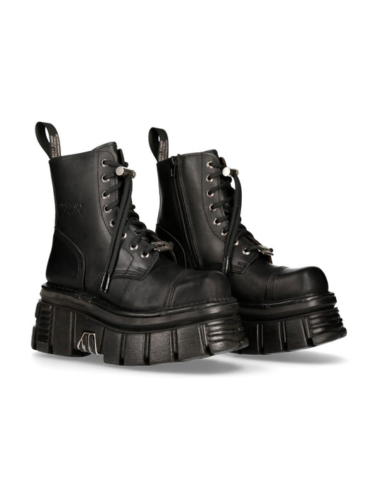 Pair of black leather boots on a white background