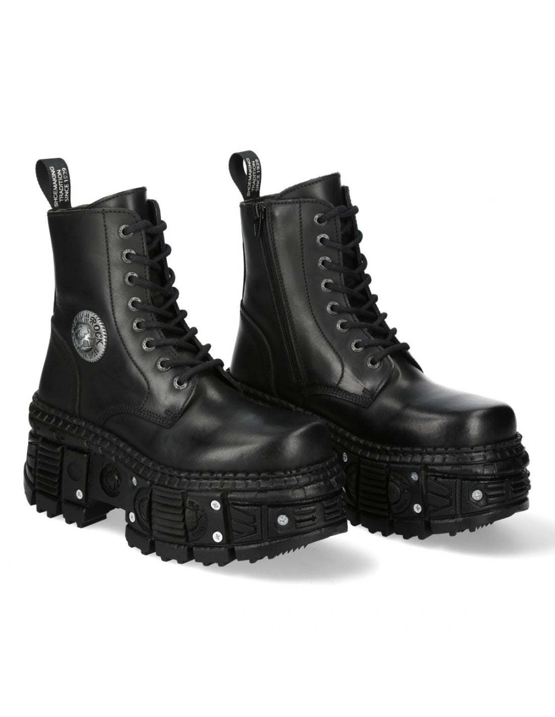 Pair of black leather boots with unique sole design on a white background