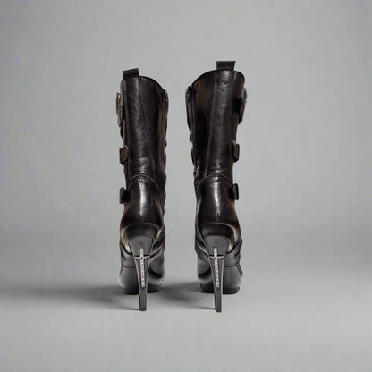 Pair of black high-heeled boots on a white background