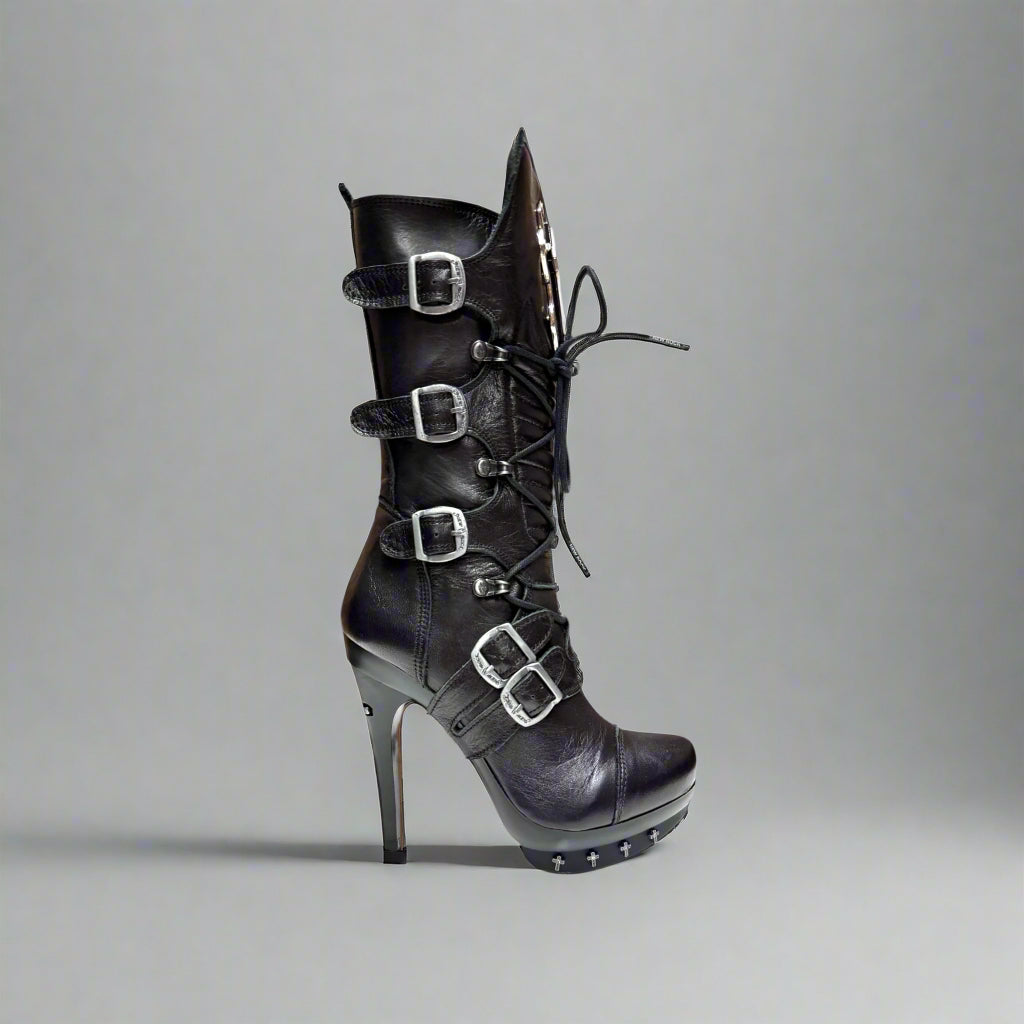 Black high-heeled boots with buckles on a white background