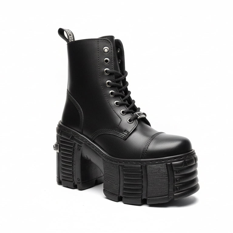 Black platform boot with chunky sole on a white background