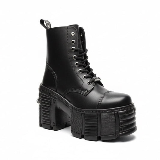 Black platform boot with chunky sole on a white background
