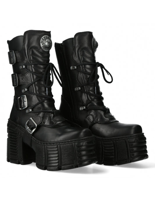 Black leather platform boots with buckles on a white background