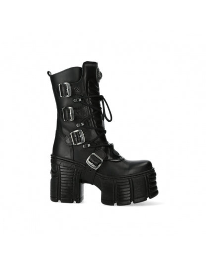 Black platform boot with multiple buckles on a white background