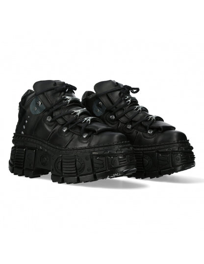 Pair of black high-top sneakers on a white background