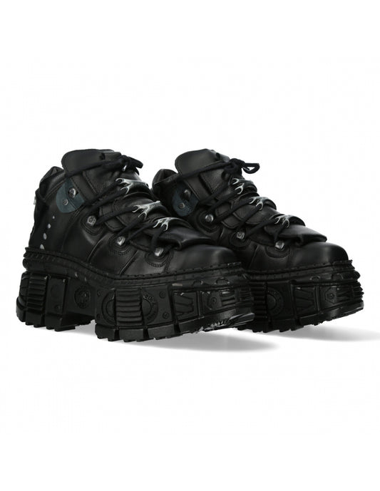 Pair of black high-top sneakers on a white background