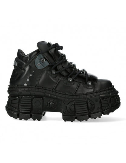 Black high-top sneaker with thick sole on a white background