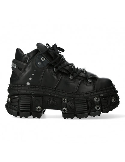 Black high-top sneaker with unique sole design on a white background