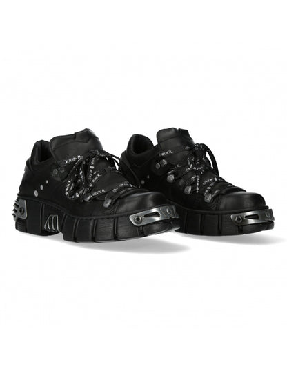 Pair of black high-top sneakers on a white background