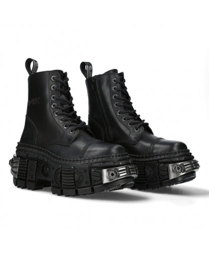 Pair of black combat boots with unique sole design on a white background