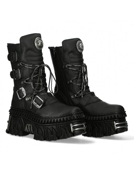 Pair of black combat boots with metallic accents on a white background