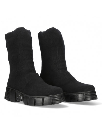 Pair of black ankle boots on a white background