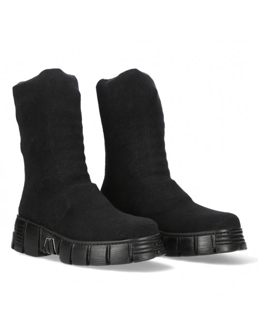 Pair of black ankle boots on a white background