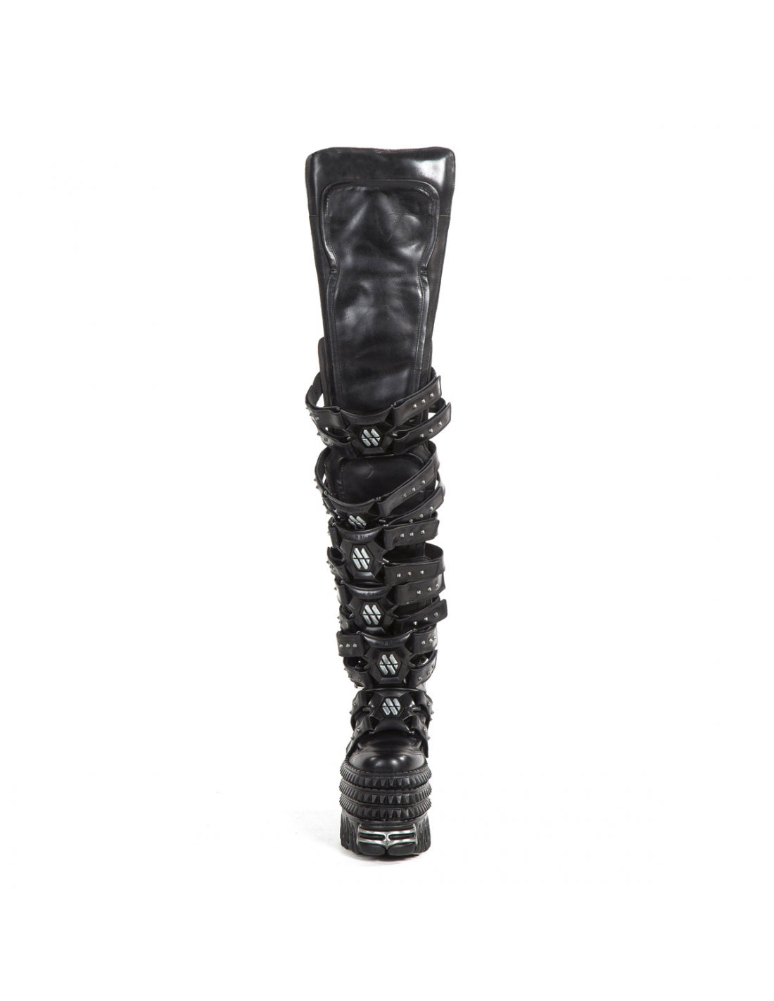 Black knee-high boot with decorative straps on a white background
